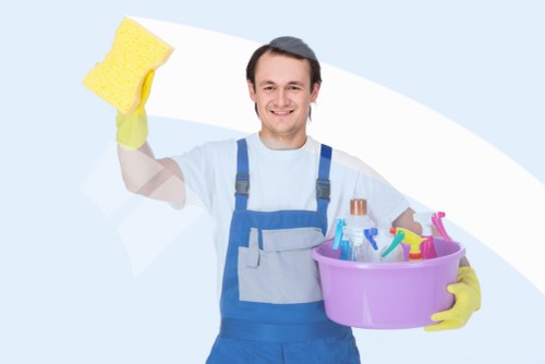Professional domestic cleaner working in a Clapham kitchen